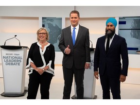 Green Party leader Elizabeth May, Conservative leader Andrew Scheer and New Democratic Party (NDP) leader Jagmeet Singh pose at the start of the Maclean's/Citytv National Leaders Debate on the second day of the election campaign in Toronto, Ontario, Canada September 12, 2019. Frank Gunn/Pool via REUTERS ORG XMIT: TOR519