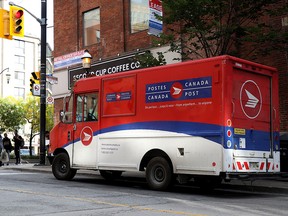 A Canada Post truck is seen illegally parked in downtown Toronto on Friday, Sept. 27, 2019. ( THE CANADIAN PRESS/Colin Perkel)