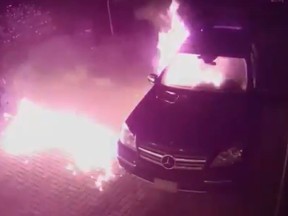 A Mercedes burns after it was set on fire in a Markham driveway on Friday, Sept. 6, 2019. (Screengrab)