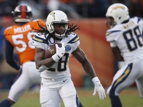 In this Dec. 30, 2018, file photo, Los Angeles Chargers running back Melvin Gordon rushes during the second half of the team's NFL football game against the Denver Broncos in Denver.