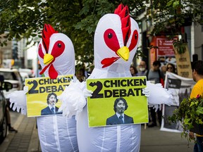 Two people in chicken costumes protest outside of a Liberal Party of Canada fundraiser, where Prime Minister Justin Trudeau was present at Cibo Wine Bar in Toronto on Wednesday September 4, 2019. (Ernest Doroszuk/Toronto Sun)