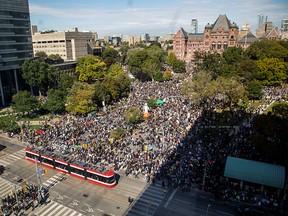 People take part in a climate change strike in Toronto, Sept. 27, 2019.