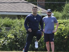 Argos QB Zach Collaros (left) will see his old backup Cody Fajardo when Toronto takes on the Saskatchewan Roughriders tonight.   (Veronica Henri/Toronto Sun)