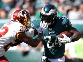 Jordan Howard of the Philadelphia Eagles stiff arms Quinton Dunbar of the Washington Redskins after making a catch in the second half at Lincoln Financial Field on Sep. 08, 2019 in Philadelphia. (ROB CARR/Getty Images)