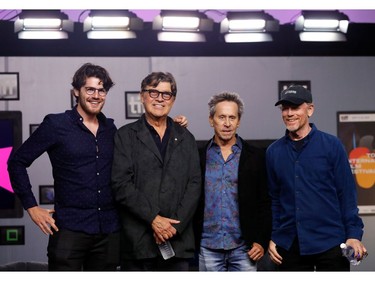 Director Daniel Roher, musician Robbie Robertson and producers Brian Grazer and Ron Howard pose during a news conference for the biopic "Once Were Brothers: Robbie Robertson and The Band" at the Toronto International Film Festival (TIFF)  in Toronto, Sept. 5, 2019.