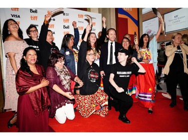 Ellen Page poses with activists at the Canadian premiere of "There's Something In The Water" at the Toronto International Film Festival in Toronto, Sept. 8, 2019.