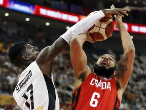 Germany's Johannes Voigtmann blocks a shot by Canada's Cory Joseph during the FIBA World Cup Monday at the Shanghai Oriental Sports Center in Shanghai. (REUTERS/Aly Song)