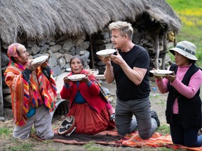 Peru – Gordon Ramsay (second from right) and a local farming family dine together and enjoy Lawa de Chuno, a classic dish made with local ingredients in Peru’s Sacred Valley. (Humble Pie Rights Limited/Justin Mandel)