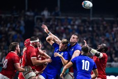 Canada (in red) and Italy (in blue) battle for possession during their Pool B match at the Rugby World Cup in Fukuoka, Japan. (GETTY IMAGES)
