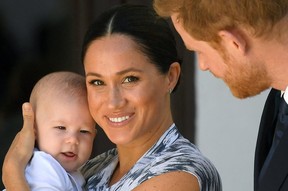 Prince Harry and his wife Meghan, Duchess of Sussex, holding their son Archie, at the Desmond & Leah Tutu Legacy Foundation in Cape Town, South Africa, September 25, 2019. REUTERS