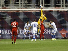 Montreal Impact goalkeeper Clement Diop (23) makes a save during first half of the second leg of Canadian Champion soccer action against the Toronto FC in Toronto, Wednesday, Sept. 25, 2019. (COLE BURSTON/THE CANADIAN PRESS)