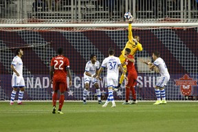 Montreal Impact goalkeeper Clement Diop (23) makes a save during first half of the second leg of Canadian Champion soccer action against the Toronto FC in Toronto, Wednesday, Sept. 25, 2019. (COLE BURSTON/THE CANADIAN PRESS)