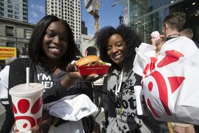 Chick-fil-A customers Jackie Mensah and Amanda David were among the many hungry people who visited the new franchise in Toronto on Friday, September 6, 2019. (Stan Behal/Toronto Sun/Postmedia Network)