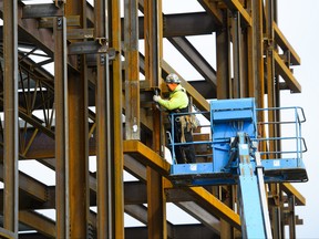 A steel worker builds a structure in Ottawa in this March 5, 2018 file photo. (THE CANADIAN PRESS/Sean Kilpatrick)