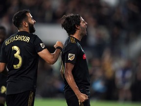 Los Angeles FC’s 
Steven Beitashour (left) celebrates with teammate Carlos Vela after a Vela goal last month. The Mexican star leads MLS with 28 tallies this season. (USA TODAY SPORTS PHOTO)