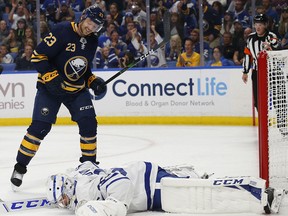 Buffalo Sabres forward Sam Reinhart (23) watches the puck go past Toronto Maple Leafs goalie Michal Neuvirth (35) Saturday, Sept. 21, 2019, in Buffalo. (AP Photo/Jeffrey T. Barnes)