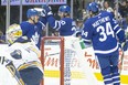 Maple Leafs' Andreas Johnsson (centre left) celebrates with left wing Kenny Agostino (20) and centre Auston Matthews (34) after scoring his team's opening goal against Buffalo Sabres during first period NHL pre-season hockey action in Toronto on Friday, September 20, 2019. (CHRIS YOUNG/THE CANADIAN PRESS)