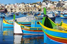 According to tradition, the colours of these Maltese fishing boats represent a fisherman's home village. (Gretchen Strauch)