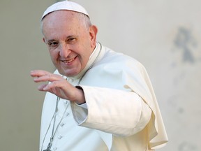 Pope Francis waves as he arrives for the weekly general audience at the Vatican, September 11, 2019.