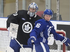 Leafs goalie Frederik Andersen (left) puts a hold on Mitch Marner at practice at the Ford Performance Centre yesterday. 
The Leafs open their season against Ottawa on Sept. 30, 2019. (Craig Robertson/Toronto Sun)