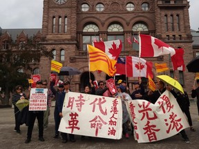 Anti-Chinese protesters at Queens Park on Saturday