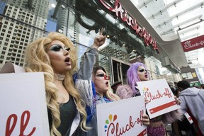 Chick-fil-A opens its doors to business on Yonge St. in downtown Toronto to lines of customers as protesters call for a boycott of the restaurant chain on Friday, September 6, 2019. (Stan Behal/Toronto Sun/Postmedia Network)