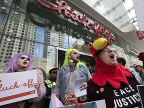 Chick-fil-A opens its doors to business on Yonge St. in downtown Toronto to lines of customers as protesters call for a boycott of the restaurant chain on Friday, September 6, 2019. (Stan Behal/Toronto Sun/Postmedia Network)