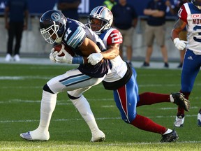 Defensive back Jonathan Mincy, then with the Als, takes down Argos’ Vidal Hazelton during a 2017 game. Mincy has resurfaced in the CFL with the Boatmen and will play his first game on Saturday.  POSTMEDIA FILES