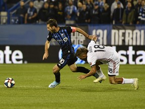 Impact’s Ignacio Piatti (left) plays the ball as Toronto FC’s Nick DeLeon loses his footing during the first half in the opening leg of the Canadian Championship final on Wednesday night at Stade Saputo in Montreal. The hosts won 1-0. (USA TODAY SPORTS PHOTO)