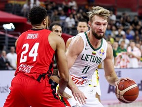 Domantas Sabonis (right) of Lithuania drives the ball against Khem Birch (left) of Canada during the 2019 FIBA World Cup at Dongguan Basketball Center in Dongguan, China, on Tuesday, Sept. 3, 2019.
