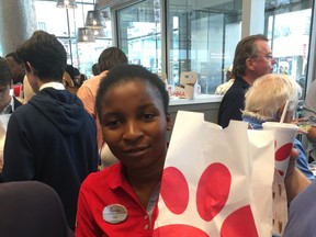 A Chick-Fil-A employee is pictured after the fast food franchise opened its first outlet in on Yonge St., near Bloor St., in September. (Joe Warmington/Toronto Sun/Postmedia Network)