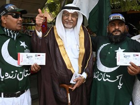 Pakistani cricket fans display tickets for an upcoming cricket match between Pakistan and Sri Lanka in Lahore. Sri Lanka's cricket team is touring Pakistan for the first time since 2009, when it was targeted in a terror attack. (ARIF ALI /Getty Images)