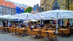 Tourists and locals alike relax with a beverage in the old town market square in Bremen. (DAVE POLLARD/Toronto Sun)