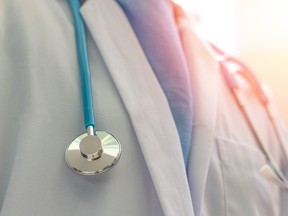 A stethoscope around a doctor's neck.