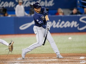 Tampa Bay Rays shortstop Willy Adames hits an RBI single against the Toronto Blue Jays during the fourth inning at Rogers Centre in Toronto on Friday, Sept. 27, 2019.