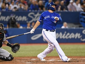 Toronto Blue Jays first baseman Rowdy Tellez  hits a home run against the Baltimore Orioles in the fourth inning at the Rogers Centre in Toronto on Wednesday, Sept. 25, 2019.