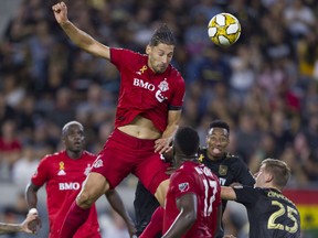 Toronto FC defender Omar González jumps up for the ball on a corner kick during the first half against Los Angeles FC at Banc of California Stadium on Saturday night. (Kelvin Kuo/USA TODAY Sports)