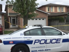 Peel Regional Police at the scene of the murder on Shelby Cres. in Mississauga on Sept. 5, 2019. (Joe Warmington/Toronto Sun)