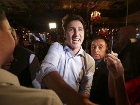 Prime Minister Justin Trudeau drops into a friendly Liberal crowd of supporters at the Flying Monkeys Craft Brewery in Barrie on Thursday, Sept. 26, 2019. (Stan Behal/Toronto Sun/Postmedia Network)