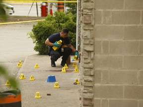 Peel Regional Police officers investigate a murder at Wally's Restaurant on Sept. 1, 2019. (Jack Boland, Toronto Sun)