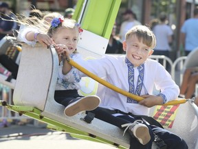 Children enjoy rides at the Toronto Ukrainian Festival in Bloor West Village on Saturday September 14, 2019.