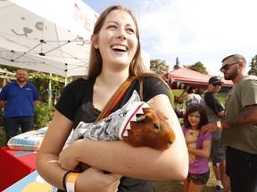 Sarah Peck, from Buffalo , N.Y. was at Greenwood Park with her pet Guinea Pig Archie Karl who was dressed up in a shark outfit for Halloween. It was all part of the 4th annual Picnic festival at Greenwood Park on Sunday September 22, 2019. Jack Boland/Toronto Sun/Postmedia Network
