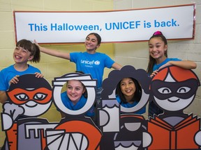 GFORCE, a musical group of five girls from the GTA who appeared on America's Got Talent, pose with a cut-out of the characters from the UNICEF Canada donation box, during an event announcing the return of UNICEF Canada Halloween donations (in electronic form) in North York's Broadlands Public School in Toronto, Ont. on Monday September 23, 2019. From left - Holly Gorski 10, Sarah De Carvalho 13, Michela Luci 13, Sienna Pesino 13, and Ava Ro 12. Ernest Doroszuk/Toronto Sun/Postmedia