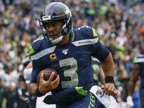 Seattle Seahawks quarterback Russell Wilson rushes for a touchdown against the New Orleans Saints on Sept. 22, 2019. (JOE NICHOLSON/USA TODAY Sports)