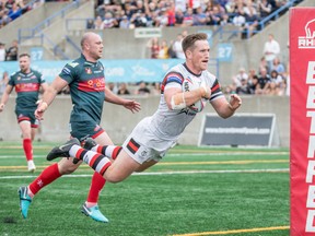 Wolfpack’s Josh McCrone dives over the try line for a score against the Leigh Centurions yesterday. (Matthew Tsang photo)