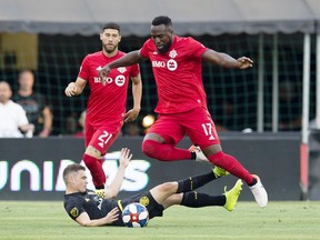 Toronto FC forward Jozy Altidore jumps over Columbus Crew SC midfielder Wil Trapp during a game earlier this season. (USA TODAY SPORTS)