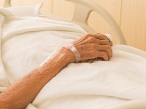 senior woman on bed patient long-term care
