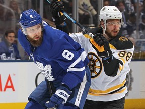 Maple Leafs’ Jake Muzzin (left) battles with the Brunis’ David Pastrnak last season in the playoffs.  Claus Andersen/Getty ImagesP