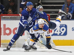 Zach Sanford #12 of the St. Louis Blues battles against Justin Holl #3 of the Toronto Maple Leafs during an NHL game at Scotiabank Arena on October 7, 2019 in Toronto. (Photo by Claus Andersen/Getty Images)