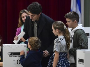 Liberal Leader Justin Trudeau is surrounded by his family as he casts his vote on election day at a polling station on October 21, 2019 in Montreal. (Photo by Minas Panagiotakis/Getty Images)